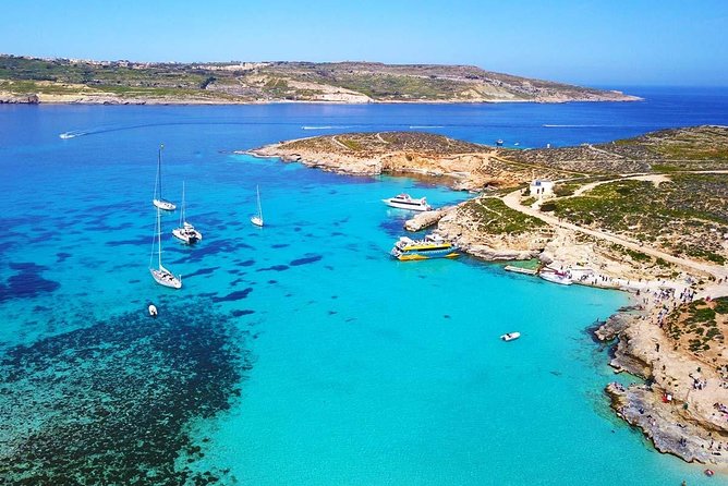 Blue Lagoon, Beaches and Bays Catamaran Sailing Tour - Ghajn Tuffieha Bay: Sand Time, Sunbathing, and Easy Chills
