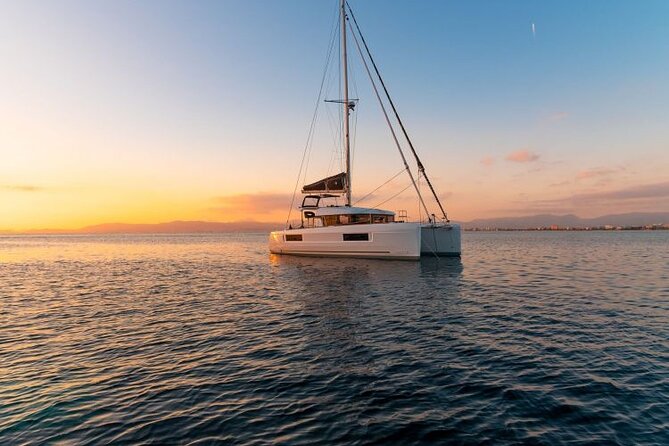 Catamaran Day & Sunset Cruises with meals Drinks and transportation - Food and drinks on board: rose wine plus a hot meal