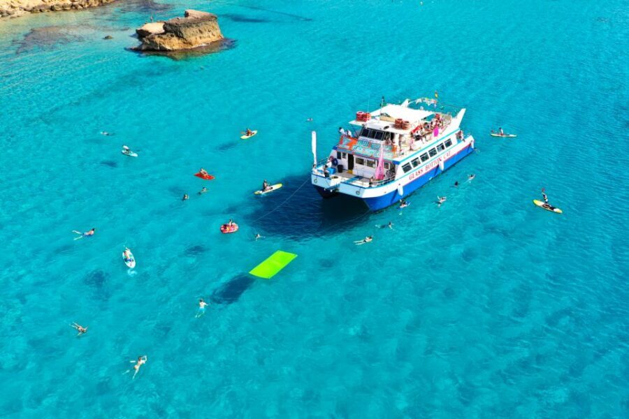 Ibiza: Beach Hopping Cruise w/ Paddleboard, Food, & Drinks - Secluded Bay Swim Playtime: Paddleboards, Snorkeling, and the Donut Floats