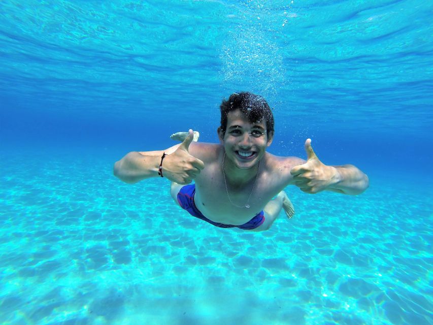 Ibiza: Snorkeling and SUP Paddle, Beach and Cave Boat Tour - Stop One: The West Coast Anchoring Near Cala Comte