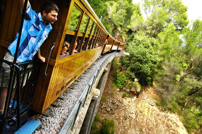 Mallorca in One Day Sightseeing Tour with Boat Ride and Vintage Train - Why this day trip works: bus, boat, tram, train