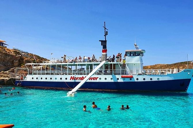 Malta: Comino, Blue Lagoon & Caves - swim, snorkel & slide - Blue Lagoon time: the mooring stop where the day actually happens