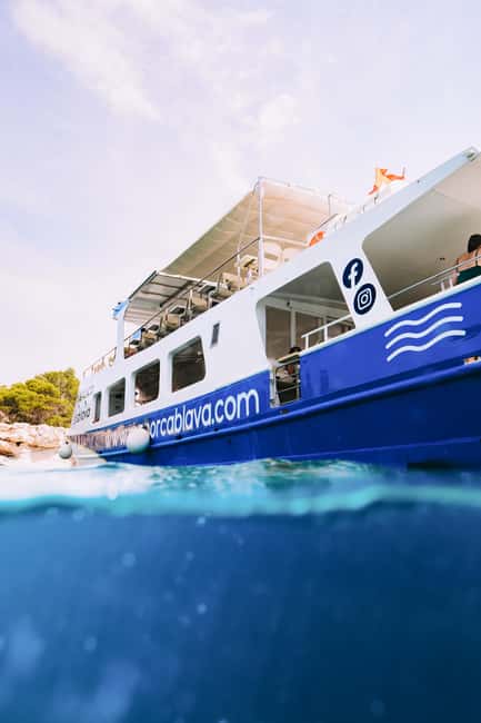 Menorca: Natural Coves and Beaches Boat Trip & Paella Lunch - Lunch afloat: paella plus sangria and orange juice