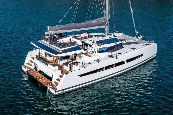 Mykonos: Brand-New Catamaran Cruise with Meal, Drinks & Transport - Rhenia Stop: Swimming, Snorkeling, and Water Toys
