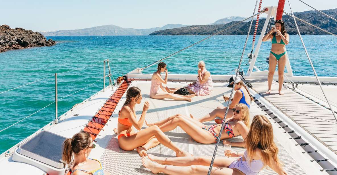 Santorini: Catamaran Tour with BBQ Dinner, Drinks, and Music - Hot springs: the caldera experience beyond postcards