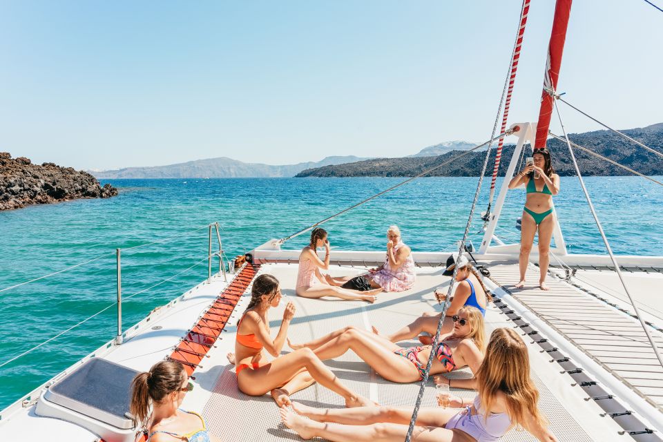 Santorini: Catamaran Tour with BBQ Dinner, Drinks, and Music - Red Beach swim and snorkeling: short, sweet, and actually doable