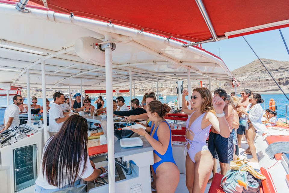 Santorini: Catamaran Tour with BBQ Dinner, Drinks, and Music - Music, atmosphere, and dancing energy (the fun kind)