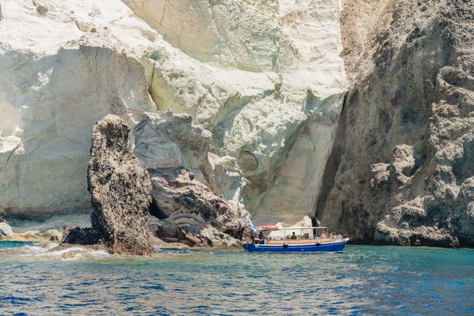 Santorini: Catamaran Tour with BBQ Dinner, Drinks, and Music - Sunset option: warm clothes, and the caldera view from the water