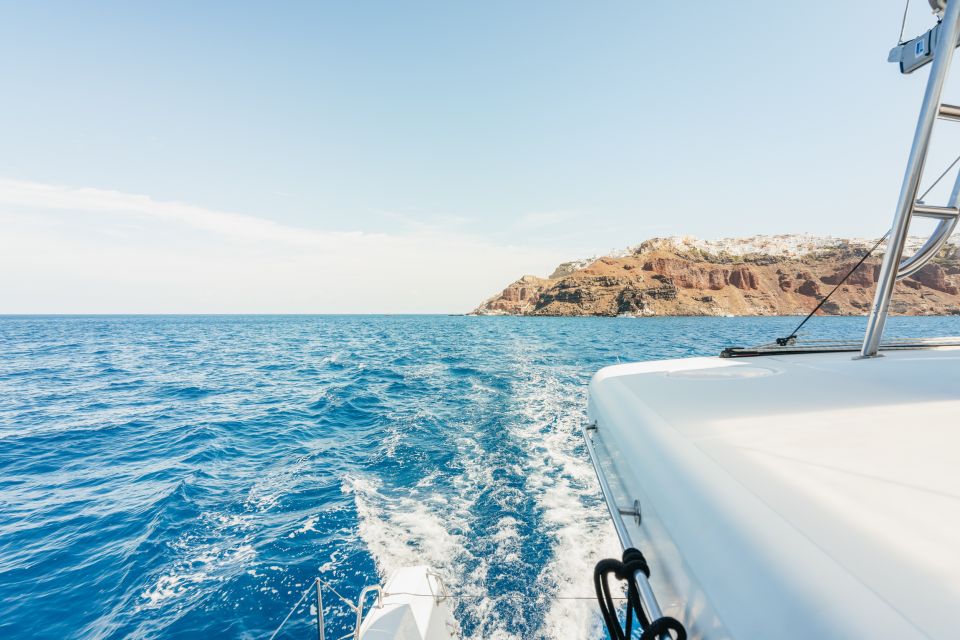 Santorini: Luxury Catamaran Day Trip with Meal and Open Bar - Sailing past the volcano islands and caldera landmarks