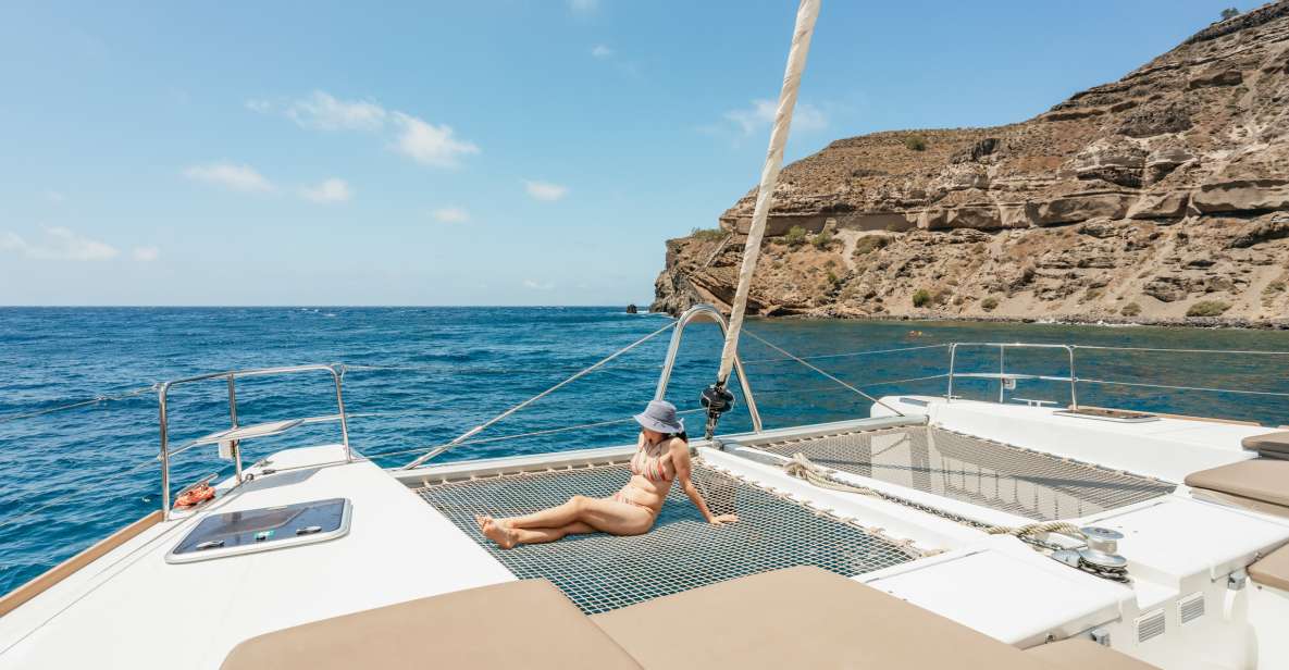 Santorini: Luxury Catamaran Day Trip with Meal and Open Bar - From hotel pickup to the marina: the flow that keeps it stress-free