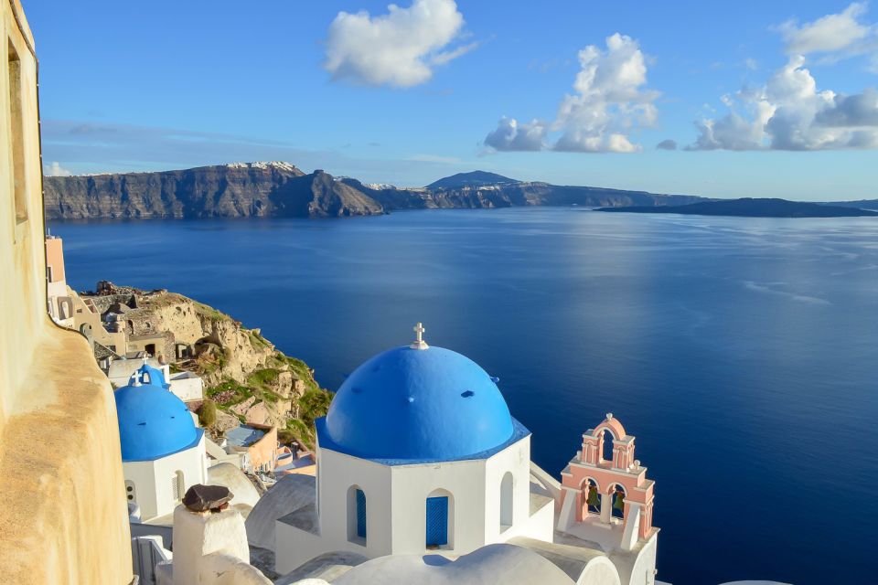 Santorini: Traditional Sightseeing Bus Tour with Oia Sunset - Emporio village: windmills, fortifications, and a real neighborhood pace
