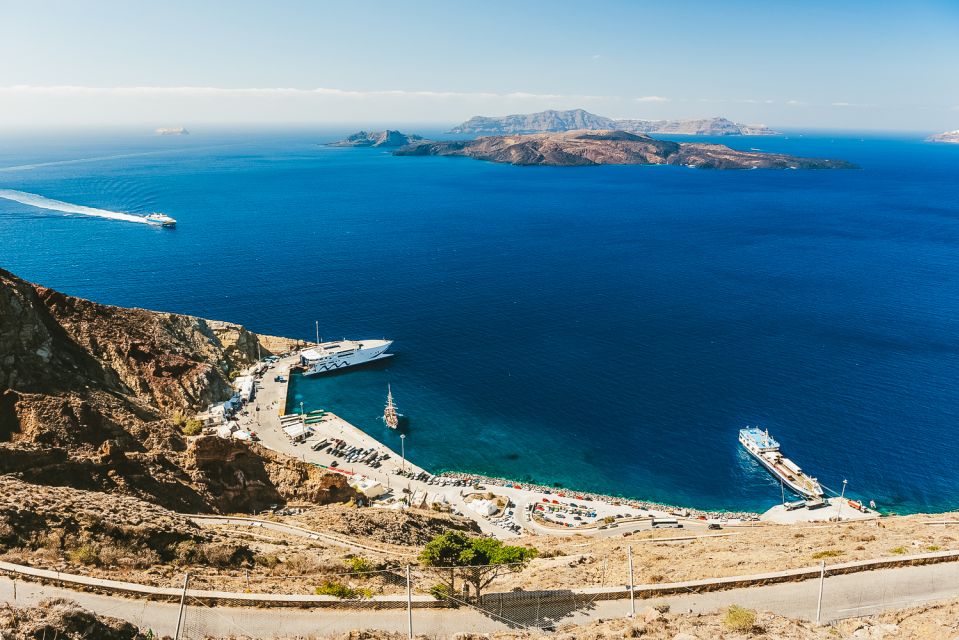 Santorini: Volcano and Hot Springs Sunset Dinner Cruise - Setting Off From Athinios Port: Caldera views start early