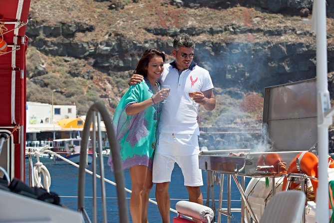 Sunset Sailing Catamaran Cruise in Santorini with BBQ and Drinks - From Ammoudi or Athinios: the first sailing lesson